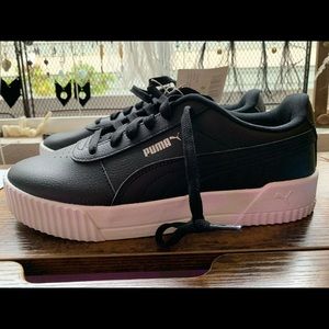 Black Puma, women’s size 9. New